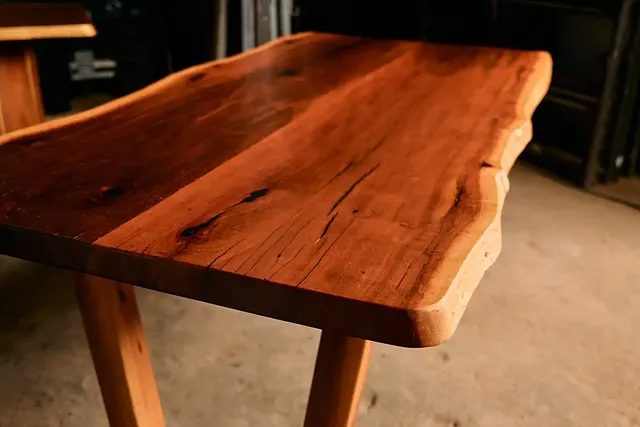 Close-up detail of a live-edge tabletop corner and grain