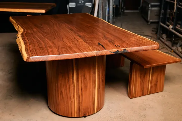 Custom live-edge dining table on cylindrical drum base, hand-built by Madera Selva